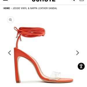 Red-ish orange heels with clear strap on the toes